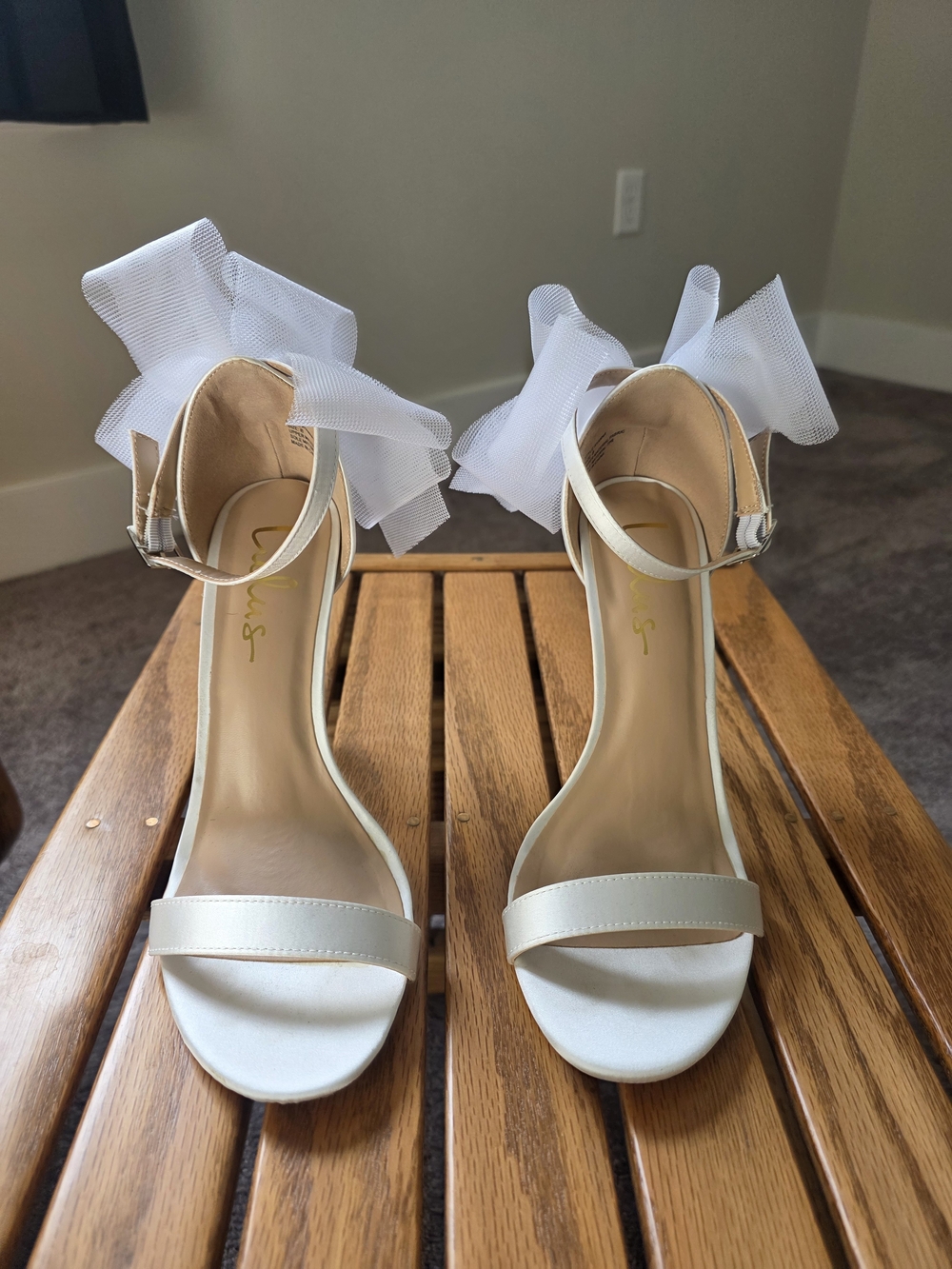Elegant White Ankle-Strap Heels with Bow Accent
